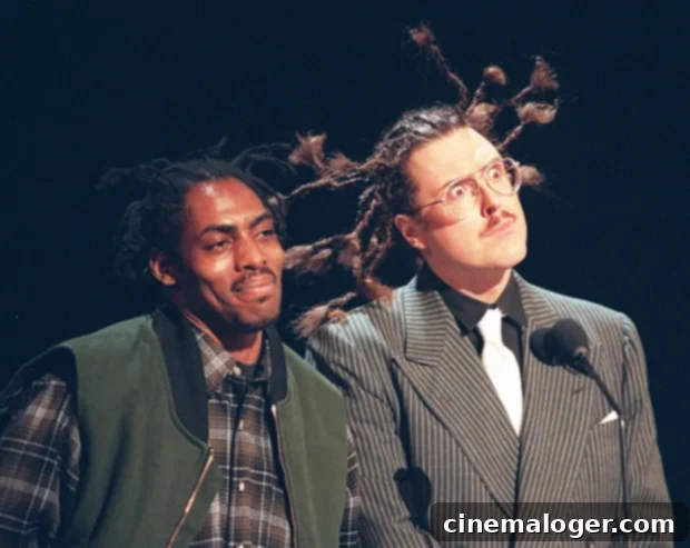 Weird Al Honors Coolio, Feud No More 2 Weird Al Yankovic and Coolio hugging backstage, a symbol of their resolved feud and friendship.