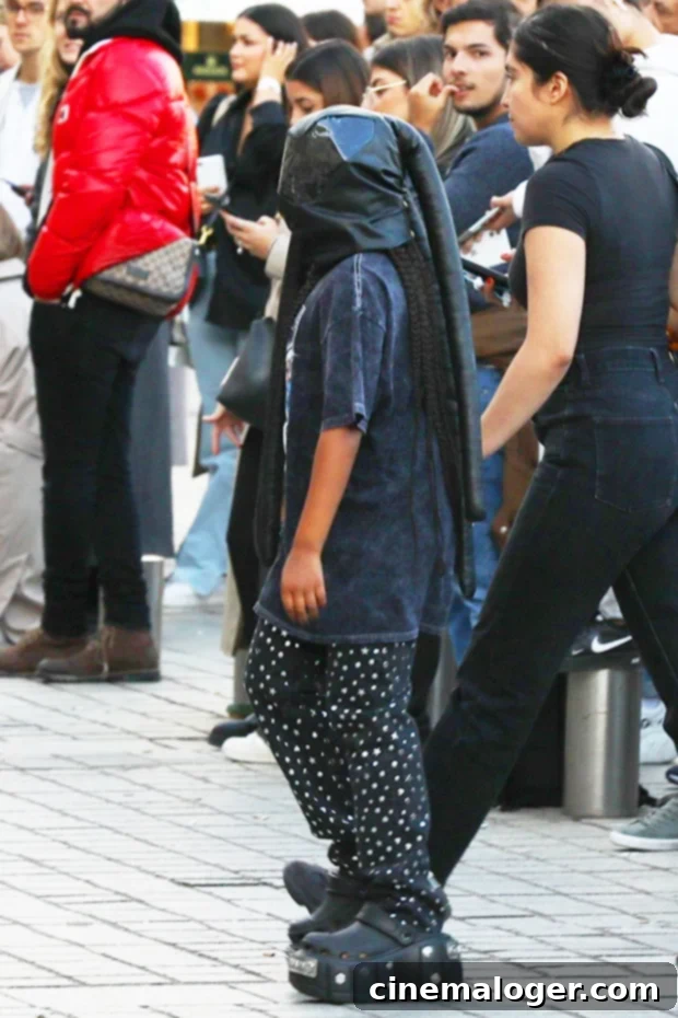 North West Adopts Kanye's Signature Masked Look In Paris 2 North West