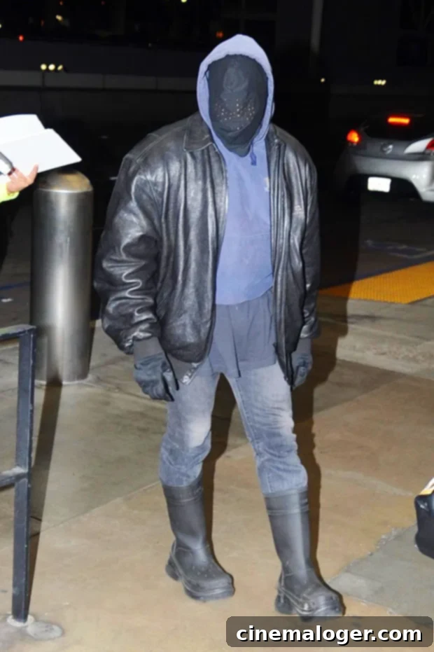 North West Adopts Kanye's Signature Masked Look In Paris 3 Kanye West