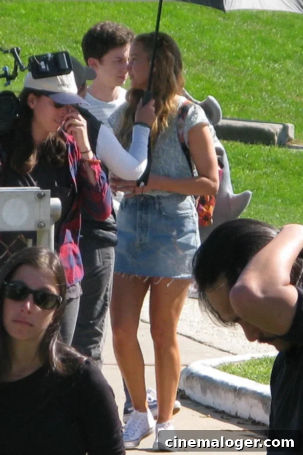 Jennifer Lawrence Serves Up Denim Mini Skirt Chic on 'No Hard Feelings' Set 2 Jennifer Lawrence in denim mini skirt on set of No Hard Feelings with shark backpack