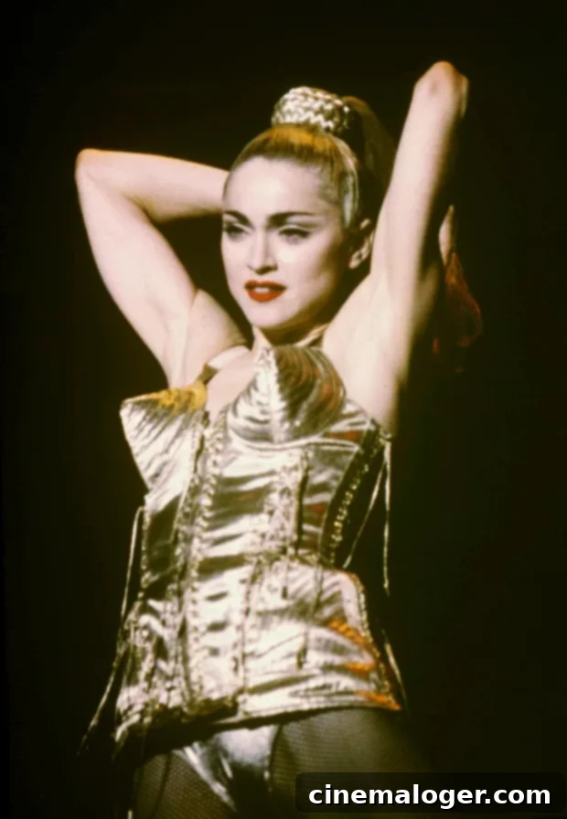 Madonna's Bold Claim: 'S.E.X.' Book Laid Foundation for Cardi B, Kardashian, Cyrus 2 Madonna performing during the 'Blonde Ambition' tour.