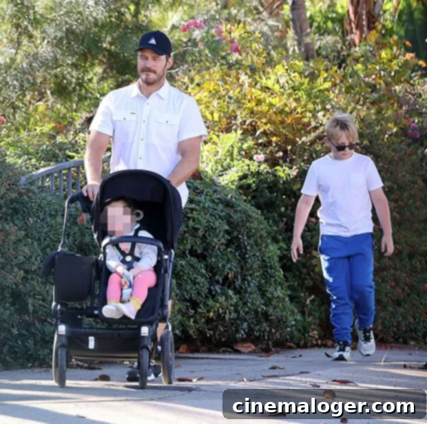 Chris Pratt, Jack Pratt, Eloise Pratt walking together during a family outing.