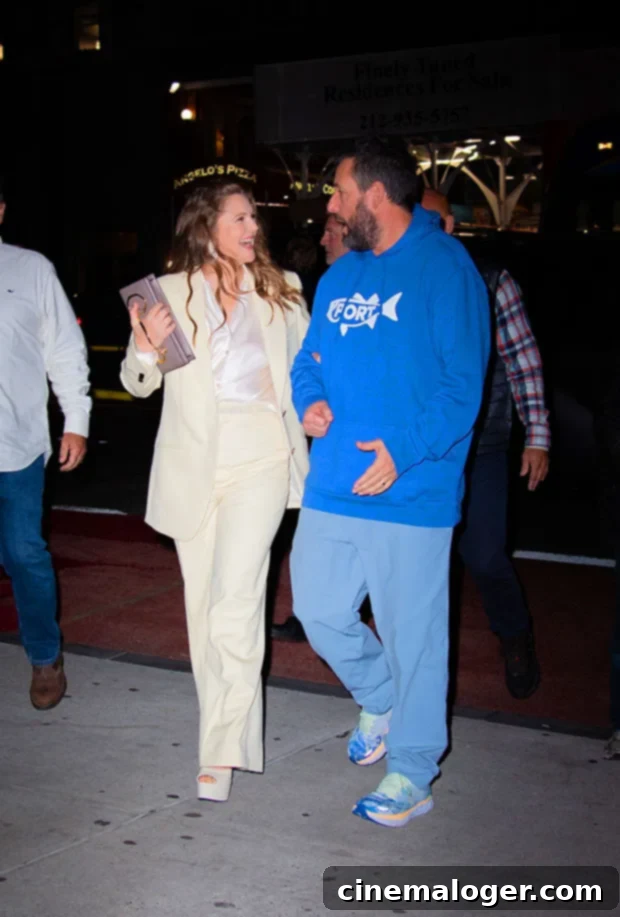 Drew Barrymore and Adam Sandler Share Sweet Reunion Hug 24 Years After Their First Film 3 Drew Barrymore and Adam Sandler pose together, showcasing their long-standing friendship.