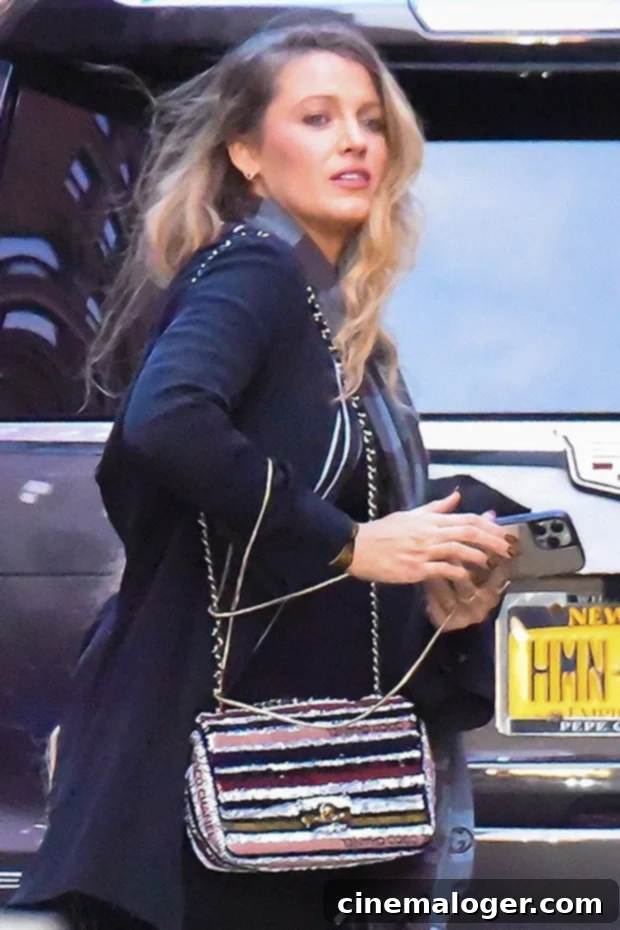 Blake Lively's Manhattan Maternity Chic 3 Blake Lively in New York City holding a striped Chanel handbag while pregnant.