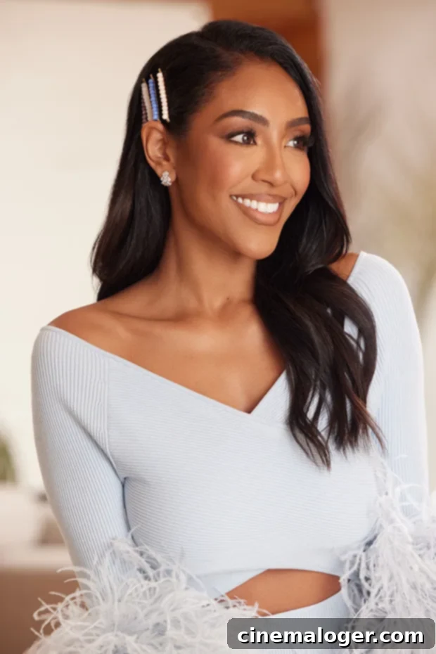 Tayshia Adams Reveals Her Favorite Holiday Beauty Gifts Under $40 2 Tayshia Adams wears her new collection.