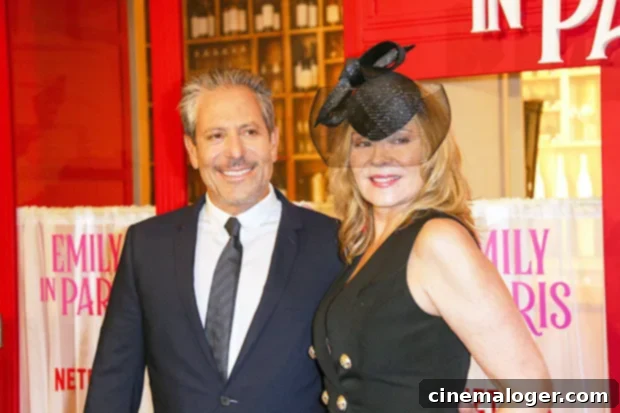 Kim Cattrall and Darren Star smiling together at the Emily in Paris premiere, supporting his show.