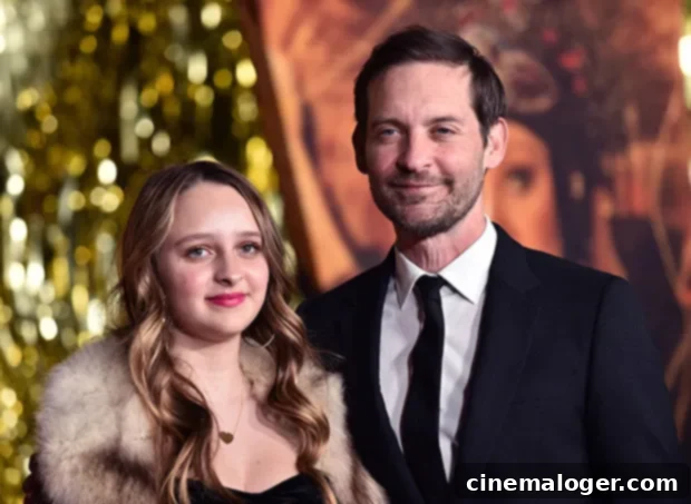 Tobey Maguire's 16-Year-Old Daughter Makes Her Grown-Up Red Carpet Debut at Babylon Premiere 3 Tobey Maguire and Ruby smiling at premiere