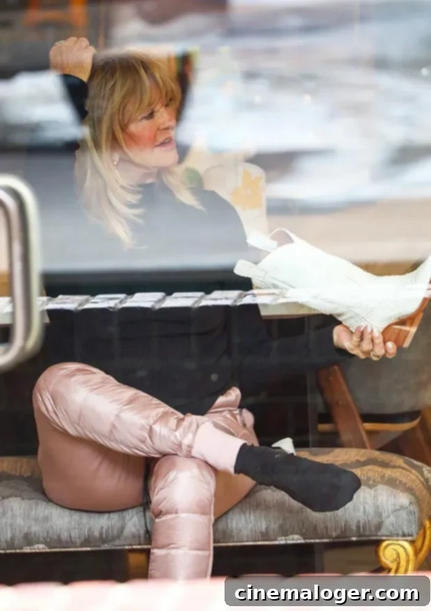 Goldie Hawn, Kate Hudson, and Rani Rose's Aspen Shopping Spree 3 Goldie Hawn trying on cowboy boots in Aspen boutique