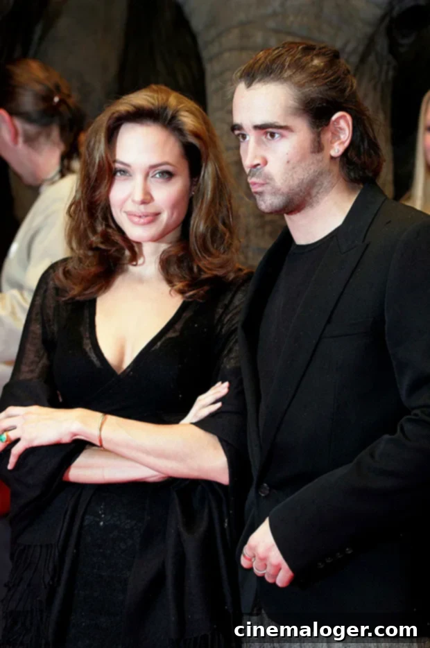 Colin Farrell’s Love Life: A Complete History of His Girlfriends 6 Angelina Jolie and Colin Farrell looking at each other.