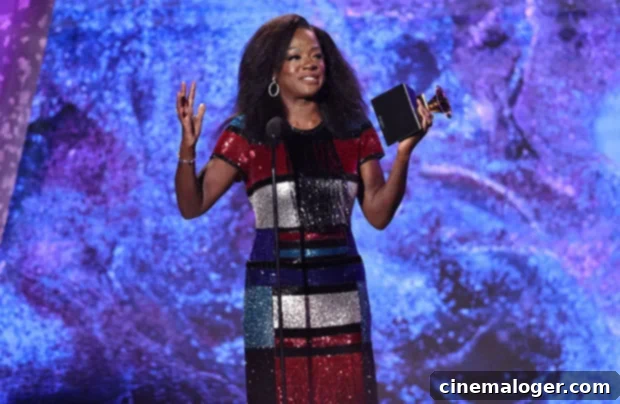 Viola Davis Shines Bright in Multi-Color Gown, Crowned EGOT Winner at Grammys 2 Viola Davis accepts her Grammy award, achieving EGOT status.