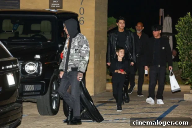 Kourtney and Travis's Family Dinner Night Out with Reign and Landon 3 Reign Disick and Landon Barker following Kourtney and Travis