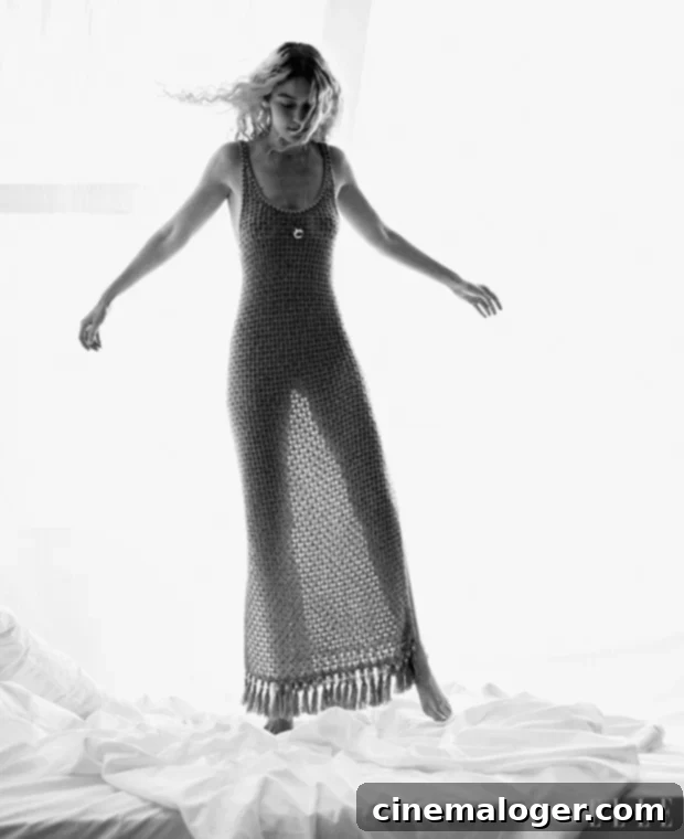Gigi Hadid Flaunts Fierce Style on New Elle Cover 5 Gigi Hadid in a sheer crochet maxi dress by Guest In Residence for Elle