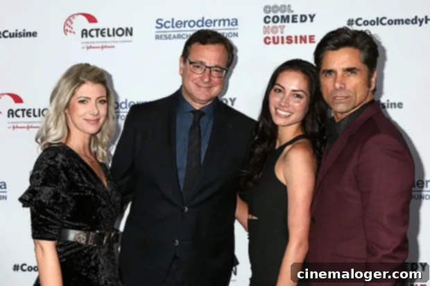 Saget Widow Kelly Rizzo Remembers Bob With Full House Family Reunion 2 Kelly Rizzo, Bob Saget, Caitlin Stamos and John Stamos pose together.