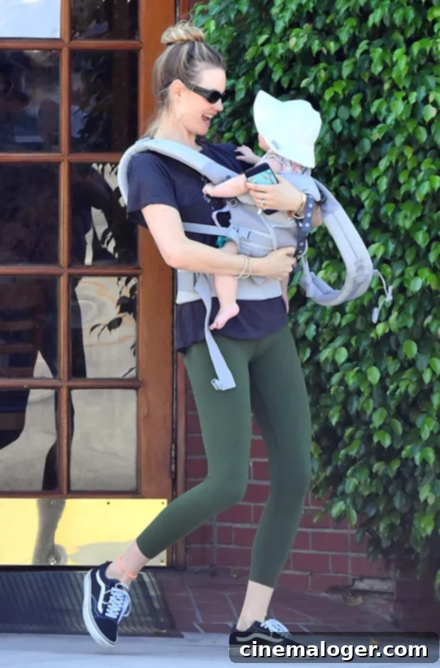 Behati Prinsloo Celebrates Gio's 5th Birthday Amidst New Baby Bliss 2 Behati Prinsloo and her daughter Gio Grace Levine smile during an outing.