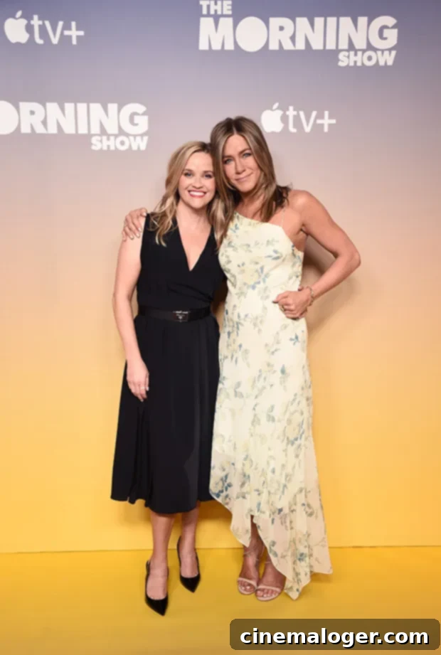 Jennifer Aniston Reese Witherspoon's Go-To For Wellness 2 Jennifer Aniston shares a laugh, looking radiant and healthy, embodying her wellness advice with a warm smile.