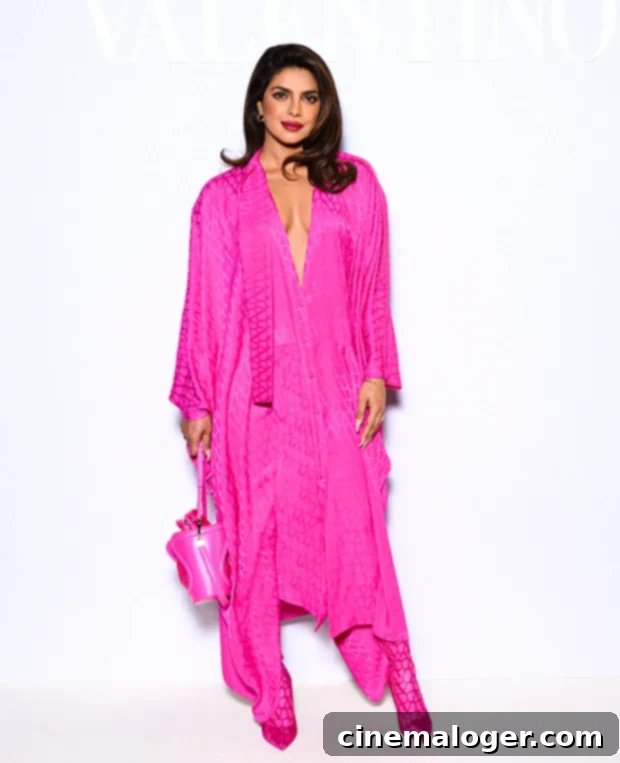 Priyanka and Nick's Pink Paris Fashion Week Statement 2 Priyanka Chopra radiant in a hot pink Valentino outfit at Paris Fashion Week.