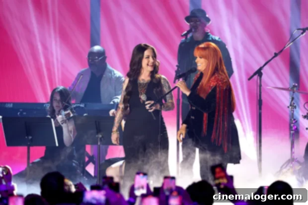 Wynonna Judd and Ashley McBryde perform at the 2023 CMT Awards, honoring Naomi Judd's memory.