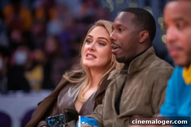 Adele Ditches Glam for Sweatpants on Lakers Date with Rich Paul 2 Adele and Rich Paul sharing a laugh courtside at an NBA game, showcasing their strong bond and affection.