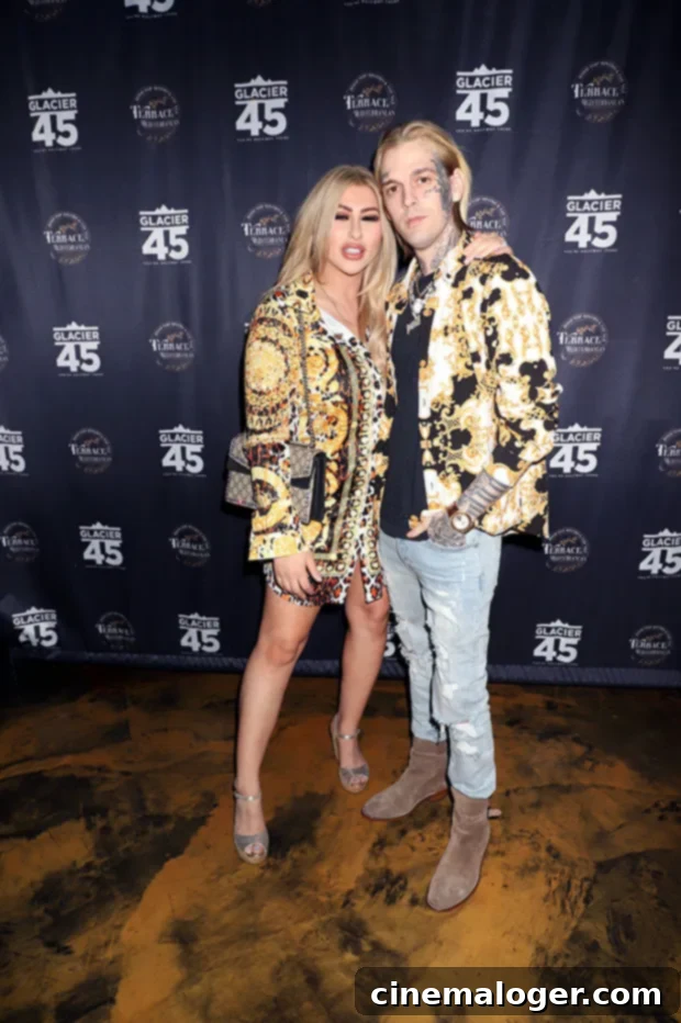 Aaron Carter's Final Downfall: Losing Son's Custody, Melanie Martin Says 2 Aaron Carter and Melanie Martin at a public event, smiling and looking engaged.