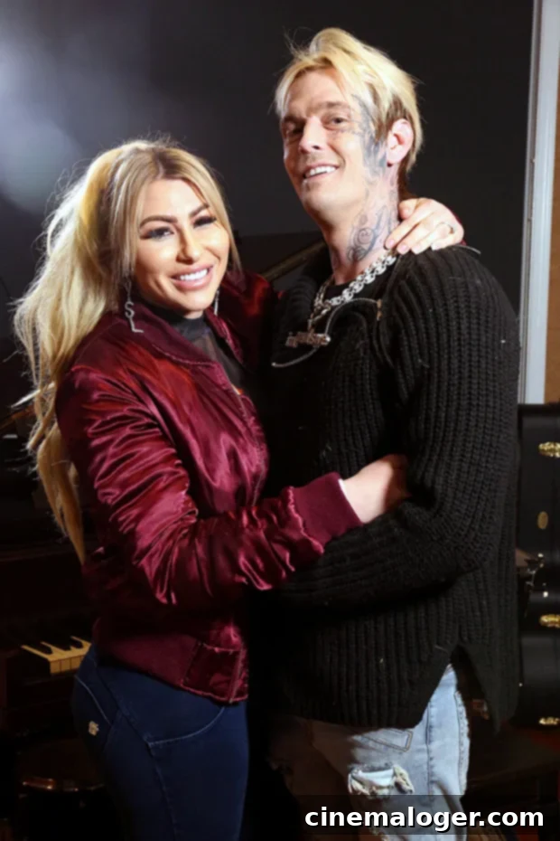 Aaron Carter's Final Downfall: Losing Son's Custody, Melanie Martin Says 3 Aaron Carter and Melanie Martin sharing a tender moment, looking happy and close.