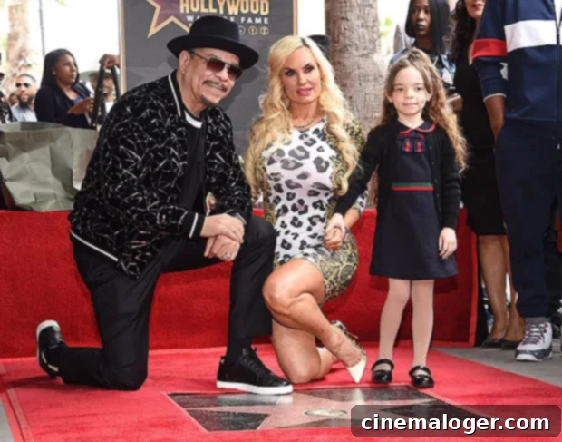 Ice-T & Coco Austin: 7-Year-Old Chanel Still In Our Bed 2 Ice-T and Coco Austin with their daughter Chanel, smiling at Ice-T's Hollywood Walk of Fame ceremony in February 2023, showcasing their close family bond.