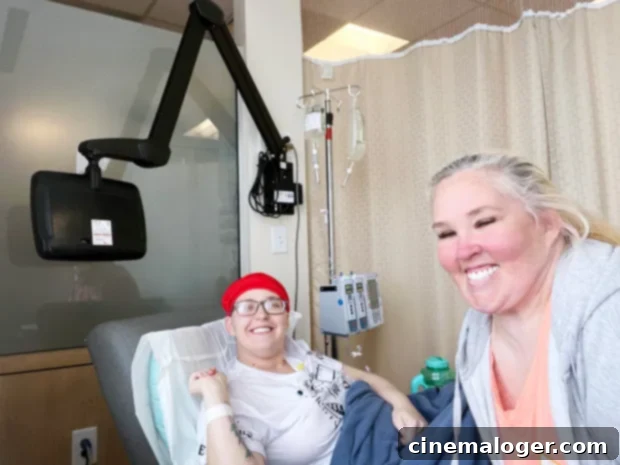 Chickadee Finds Joy Daughter's Graduation Amidst Cancer Fight 2 Chickadee smiles with Mama June for a photo as she begins chemo.