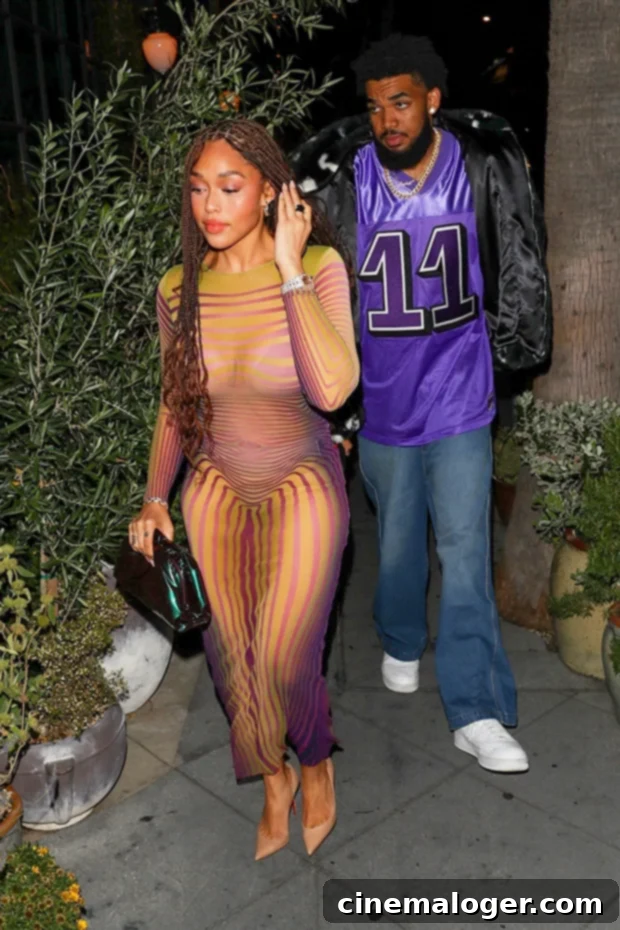 Jordyn Woods Stuns In Monokini, Shares Steamy PDA With Karl-Anthony Towns In Mykonos 3 Jordyn Woods and Karl-Anthony Towns enjoying a romantic date night, radiating happiness and showcasing their journey as a strong celebrity couple.