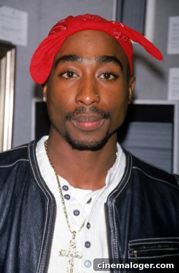 Tupac Shakur's Murder: The Arrest and Everything We Know About the Case 2 Tupac Shakur, a renowned hip-hop artist, is depicted in a classic black and white portrait, widely regarded as one of the greatest rappers of all-time.