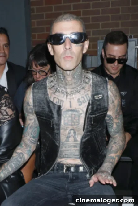 Travis Barker's Health: The Full Story of His Pancreatitis and Other Struggles 2 Travis Barker posing with his distinctive tattoos