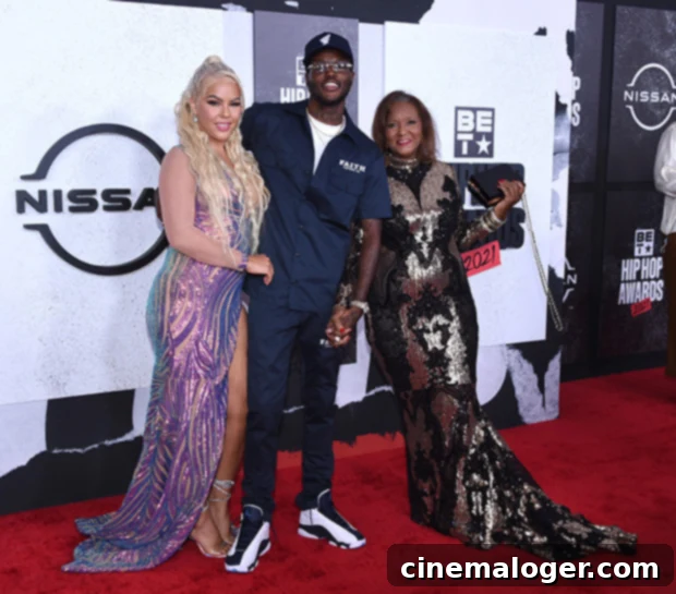 DC Young Fly's Heartbreak Deepens: Sister Dies Months After Partner Jacky Oh 2 DC Young Fly with his mother and his late partner, Jacky Oh.