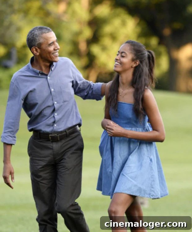 Malia Obama Rocks Bold Red Locks in Latest Photos 2 Malia Obama with her father Barack Obama in 2015