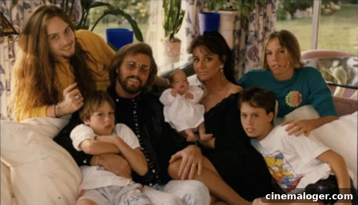 Barry Gibb's 5 Children: Meet Steve Gibb and The Rest of His Family 4 Barry Gibb posing for a family portrait with wife Linda and their five children