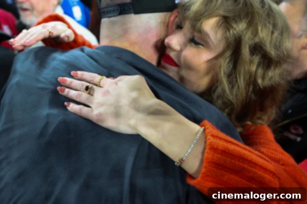 Taylor Swift Touches Down in US After 12-Hour Super Bowl Flight 3 Taylor Swift embracing Travis Kelce on the field after a Kansas City Chiefs victory, showing their public display of affection.