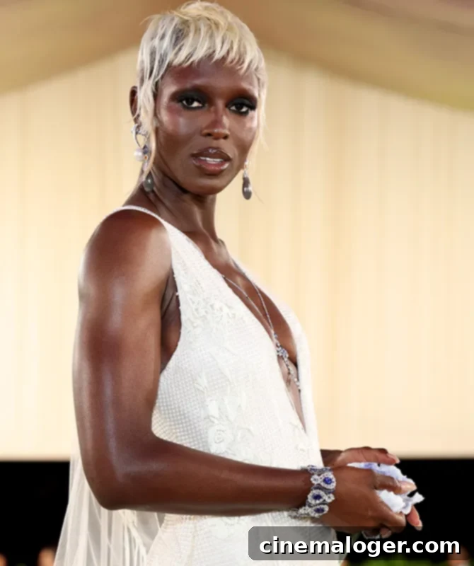 Jodie Turner-Smith's Met Gala Bridal Nod: A Post-Split New Chapter 2 Jodie Turner-Smith at the 2024 Met Gala in a white floral gown by Burberry, symbolizing rebirth and self-love.