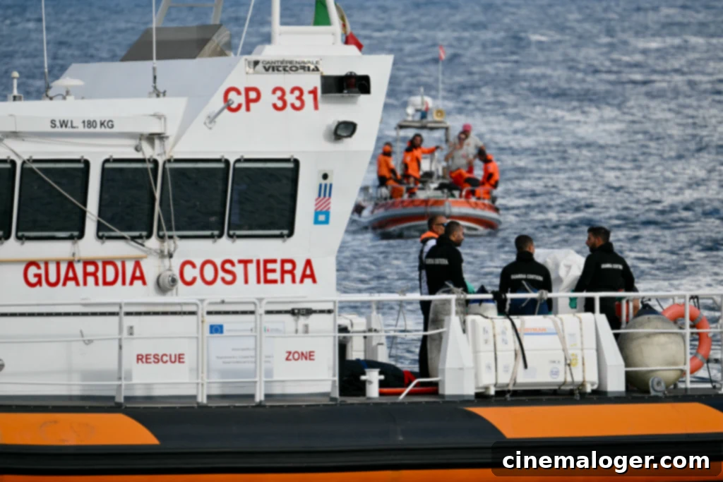 The Yacht Mike Lynch Nearly Sold Before Tragedy 2 Italian Coast Guards carry a body on a rescue boat in Porticello harbor near Palermo, with a third body at the back of the boat on August 21, 2024, two days after the British-flagged luxury yacht Bayesian sank. Divers searching for six missing people following the sinking of a superyacht off Sicily in a storm have found four bodies, a source close to the search told AFP. The Bayesian, which had 22 people aboard including 10 crew, was anchored some 700 metres from port before dawn when it was struck by a waterspout. Among the six missing were UK tech entrepreneur Mike Lynch and his 18-year-old daughter Hannah, and Jonathan Bloomer, the chair of Morgan Stanley International, and his wife Judy. (Photo by Alberto PIZZOLI / AFP) (Photo by ALBERTO PIZZOLI/AFP via Getty Images)
