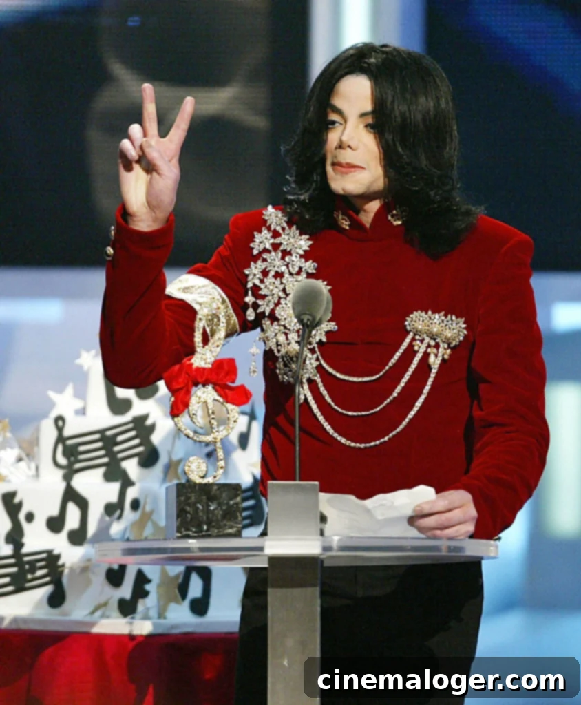 The Video Vanguard Pantheon All MTV VMA Honorees 6 NEW YORK, UNITED STATES: US singer Michael Jackson makes a peace sign at the MTV Video Music Awards 29 August, 2002 in New York after receiving the Performer of the Millennium Award. Jackson, who is due to appear in court 16 January 2003 on child sex abuse charges, earned the title "King of Pop" with the best-selling album ever -- but his star has waned considerably in the two decades since then. Jackson, is to be arraigned on seven counts that include lewd acts against a 14-year-old boy. He has to declare whether he is innocent or guilty after Santa Barbara prosecutors filed the charges against him on 18 December. AFP PHOTO/TIMOTHY A. CLARY (Photo credit should read TIMOTHY A. CLARY/AFP via Getty Images)