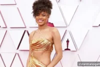 Andra Day Shines as a Golden Icon at the Oscars in Dazzling Cutout Gown