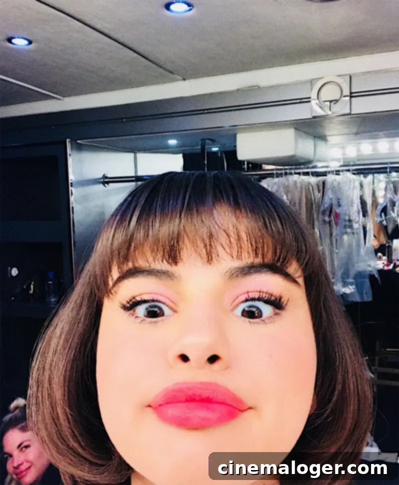 Selena Gomez with a plump pout and short bob hairstyle, showcasing her new look.