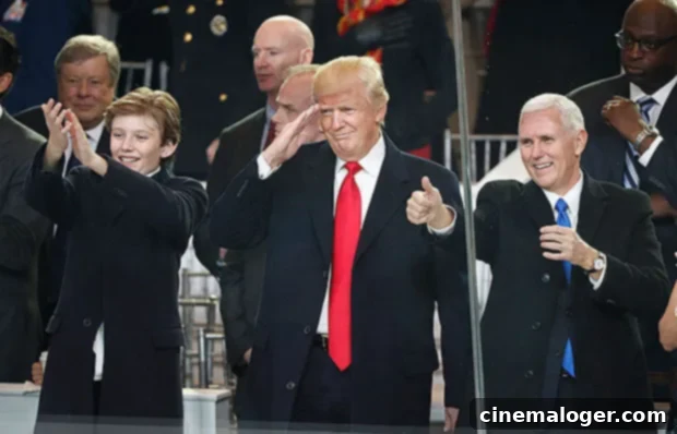 President Donald Trump, his son Barron, left, and Vice President Mike Pence view the Presidential Inauguration parade