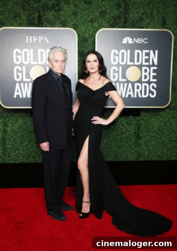 Catherine Zeta-Jones and Michael Douglas share a moment on the Golden Globes red carpet, exuding timeless Hollywood glamour.