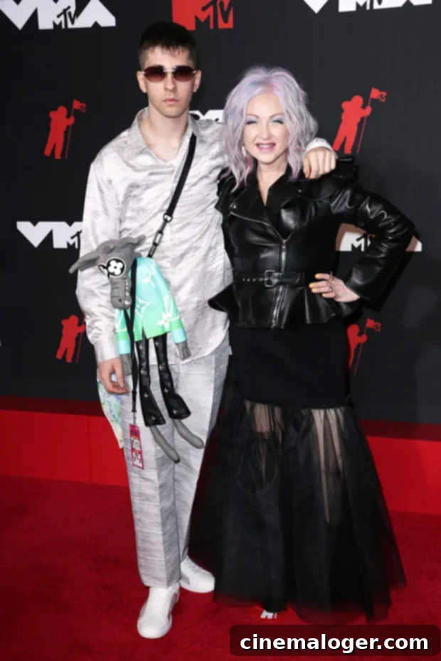 Cyndi Lauper's Son Declyn 23 Joins Her For Rare VMA Red Carpet Appearance 3 Cyndi Lauper speaks on stage at the 2021 MTV VMAs.