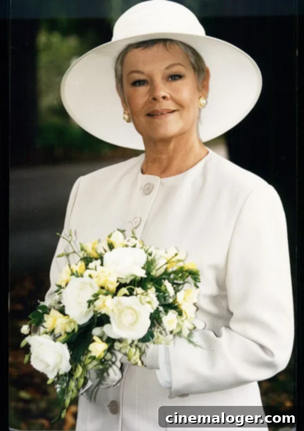 Judi Dench with a thoughtful expression, dressed in a patterned jacket