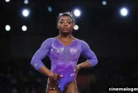 Simone Biles Radiates Beach Bliss in Peach Swimsuit