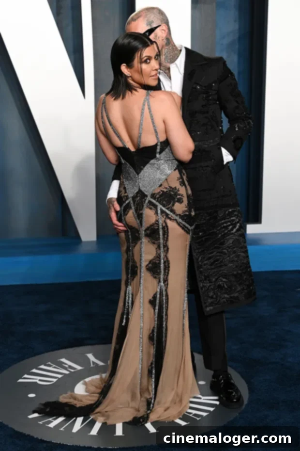 Kourtney Kardashian & Travis Barker show PDA at Vanity Fair Oscars After-Party